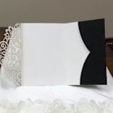 "Qty of 50 Custom Black Glitter Lovely Sash Rose Tri-fold Laser Cut | Other Color Options Available" - Invitation Pockets in white by Papel Custom Design