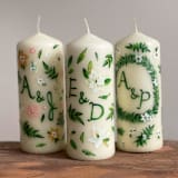 "Monogrammed Ivory with Greenery and White Floral Hand-Painted 6” Pillar Candle, Set of 1" - Candles in beige by Ashley Myers