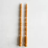 "SET OF 2 - SPINDLE LEG TAPERS // ORO" - Candles in yellow by borrowed BLU
