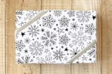"Snow Flakes" - Wrapping Paper in White Xmas by Daniela - Front