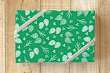 "All Over Pine" - Wrapping Paper in Mint Green by Anupama - Front
