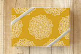 "mums" - Wrapping Paper in saffron gold by Lori James - Front