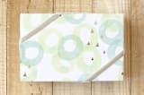 "Peaceful Rings" - Wrapping Paper in Chartreuse by Milk and Marrow - Front
