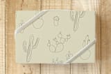 "Joshua Tree Cacti" - Wrapping Paper in Sand by DESIGN X FIVE - Front