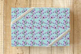 "Blossoms on a Branch" - Wrapping Paper in Blue Bird by Lauren Hughes - Front