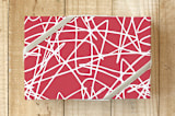 "Ice Tracks" - Wrapping Paper in Celebration Red by Jan Shepherd - Front