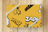 "Super Hero Comic" - Wrapping Paper in Comic Book Yellow by MinimalType - Front