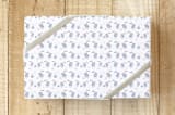 "Flamingo Flair" - Wrapping Paper in Blue Lagoon by Jenna Skead - Front