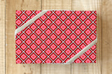 "Geo Squares" - Wrapping Paper in Kissing Red by Michelle Locklear - Front