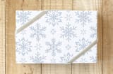 "Mixed Flurries" - Wrapping Paper in Snow by Rebecca Smith - Front
