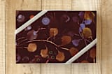 "Garden View" - Wrapping Paper in Burgundy by Aspa Gika - Front