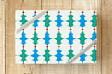 "Holly Leaves with Berries" - Wrapping Paper in Nougat by IGGI - Front