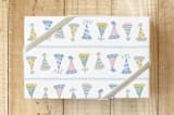"Party Hat Parade" - Wrapping Paper in Mint by Tina Faselli - Front