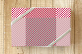 "Optical check" - Wrapping Paper in Optical red by Bethania Lima - Front