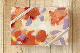 "Petal Dance 2" - Wrapping Paper in autumn orange by sue prue - Front