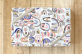 "Sweet little arcs" - Wrapping Paper in blue arc by Bethania Lima - Front