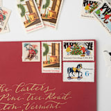 "Sledding and Christmas Toys Postage Set // Set of 5 // UNUSED // Vintage Holiday Stamps" - Postage Stamps in red by Flourish Fine Writing