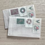 "83 cents . Christmas Wreath Vintage Postage Stamps . Set of 5" - Postage Stamps in red by Kristen Melchor