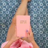 "Living My Best Life  - Bellini Pink Hardcover Journal" - Notebook in pink by Chez Gagné