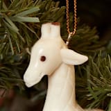 "Mini Tagua Ivory Giraffe Ornament" - Ornaments in beige by Aahlada Chennupati