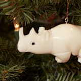 "Mini Tagua Ivory Rhinoceros Ornament" - Ornaments in beige by Aahlada Chennupati