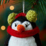 "Felt Sledging Penguin Ornament" - Ornaments in black by Aahlada Chennupati