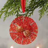 "Maasai Beads Red Flower Ornament" - Ornaments in beige by Aahlada Chennupati