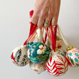 "Bronze & Red Mini Bow Hand Painted Ceramic Ornament" - Ornaments in red by Kara Aina