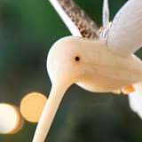 "Mini Tagua Ivory Humming Bird Ornament" - Ornaments in beige by Aahlada Chennupati