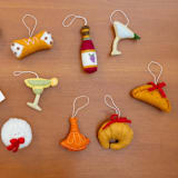 "Felt Croissant" - Ornaments in beige by Global Goods Partners