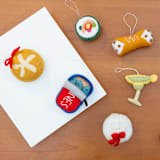 "Felt Dumpling" - Ornaments in white by Global Goods Partners