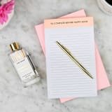 "To Complete Before Happy Hour - Lined Notepad" - Notepad in orange by Chez Gagné