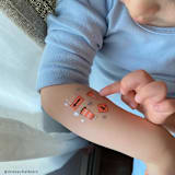 "Under Construction Temporary Tattoos - Pack of 2" - Party Favors in multicolor by Jollity and Co