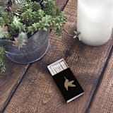 "Hummingbird Matchbox, Silver on Black" - Party Matches and Matchbooks in black by Jessica Cunningham