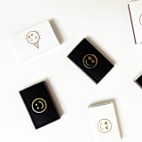 "Party Emoji Matchbox, Gold on White" - Party Matches and Matchbooks in white by Jessica Cunningham