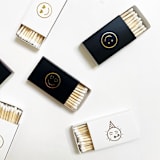"Party Emoji Matchbox, Gold on White" - Party Matches and Matchbooks in white by Jessica Cunningham