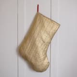 "Gold Quilted Stocking with Red Ribbon Hook Detail" - Stockings in gold by Quiet Goods