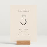 "Modernist Monogram" - Table Numbers in Latte by Christie Garcia - Displayed (stand not included)