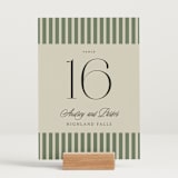 "holiday ribbon" - Table Numbers in Ruby by Jackie Crawford - Displayed (stand not included)