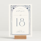 "Nouveau Frame" - Table Numbers in Delphinium by Ashley DeMeyere - Displayed (stand not included)