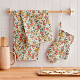 "Field of Florals" - Tea Towel in Scarlet by Kelsey Carlson - In Home