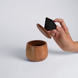 "Elegant Round Storage Box with Black Onyx Handle" - Vanity Trays and Dishes in black by Powered By People
