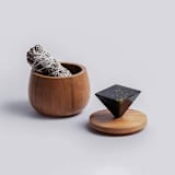 "Elegant Round Storage Box with Black Onyx Handle" - Vanity Trays and Dishes in black by Powered By People