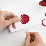 "And So The Adventure Begins in Red | Sablewood Paper Company x Artisaire (pack of 25)" - Wax Seals, Pack of 25 in Sangria by Minted - Adhesive Backer