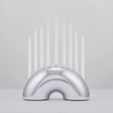 "Nosh Menorah - Chrome" - Candle Holders in pink by Leadoff Studio