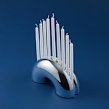 "Nosh Menorah - Chrome" - Candle Holders in pink by Leadoff Studio