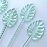"Monstera Stir Sticks - Transparent Light Green (Set of 25)" - Stir Sticks in green by Atomic Kraftworks