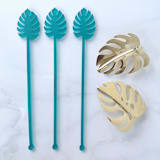 "Monstera Stir Sticks - Frosted Teal (Set of 25)" - Stir Sticks in black by Atomic Kraftworks