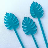 "Monstera Stir Sticks - Frosted Teal (Set of 25)" - Stir Sticks in black by Atomic Kraftworks