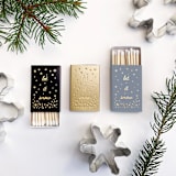 "Let It Snow Matchbox, Gold on Dusty Blue" - Matchbooks and Matches in gold by Jessica Cunningham